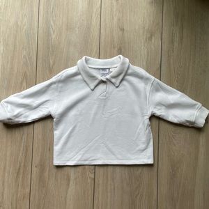 White collared sweater